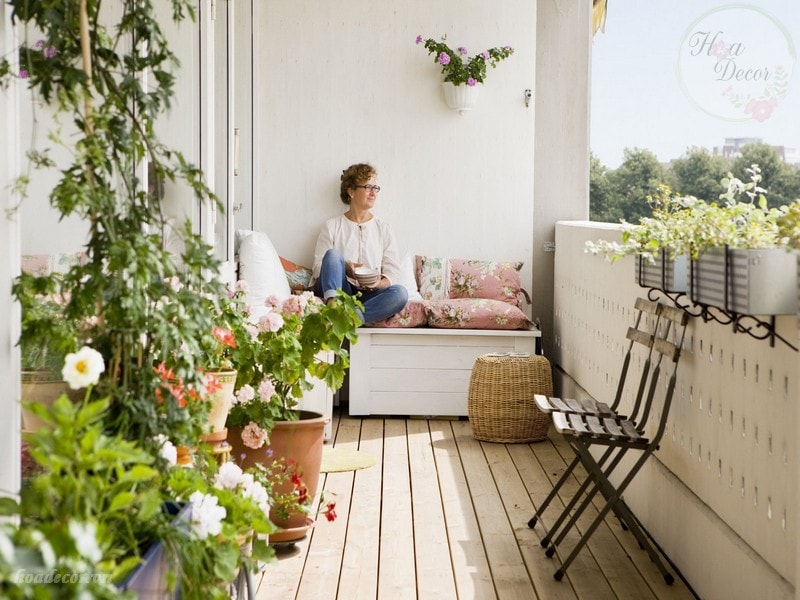 Woman Relaxing On Balcony